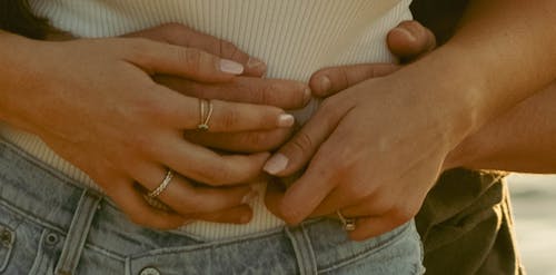 Hands of Couple Hugging