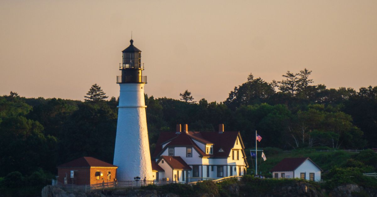Portland Head Light from the bay at sunset