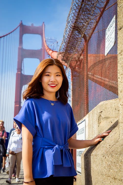 Smiling Woman on Bridge