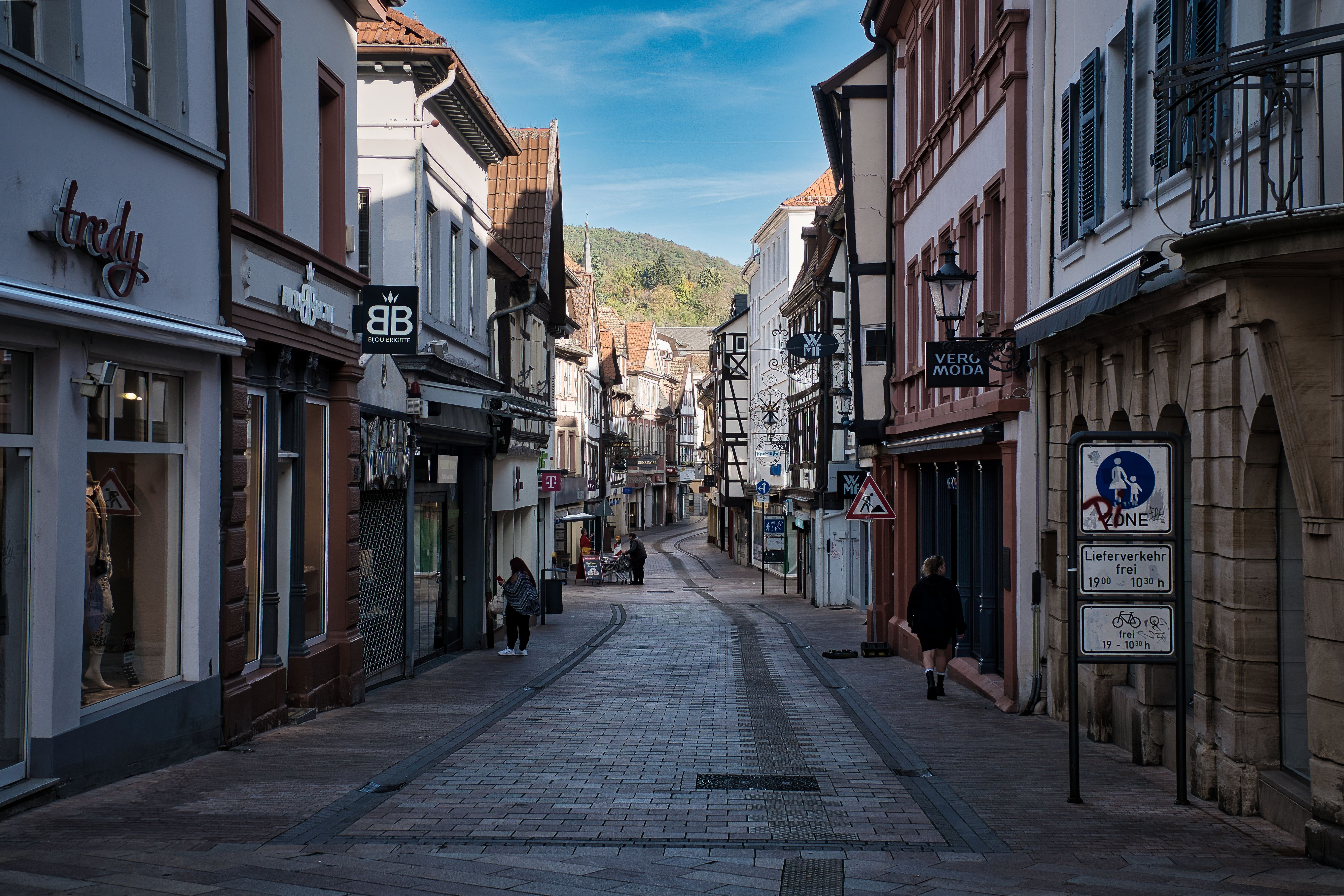 Picturesque street view in Neustadt, Germany, featuring quaint shops and historic architecture.