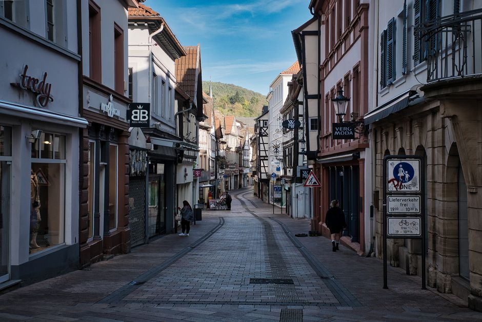 Picturesque street view in Neustadt, Germany, featuring quaint shops and historic architecture.