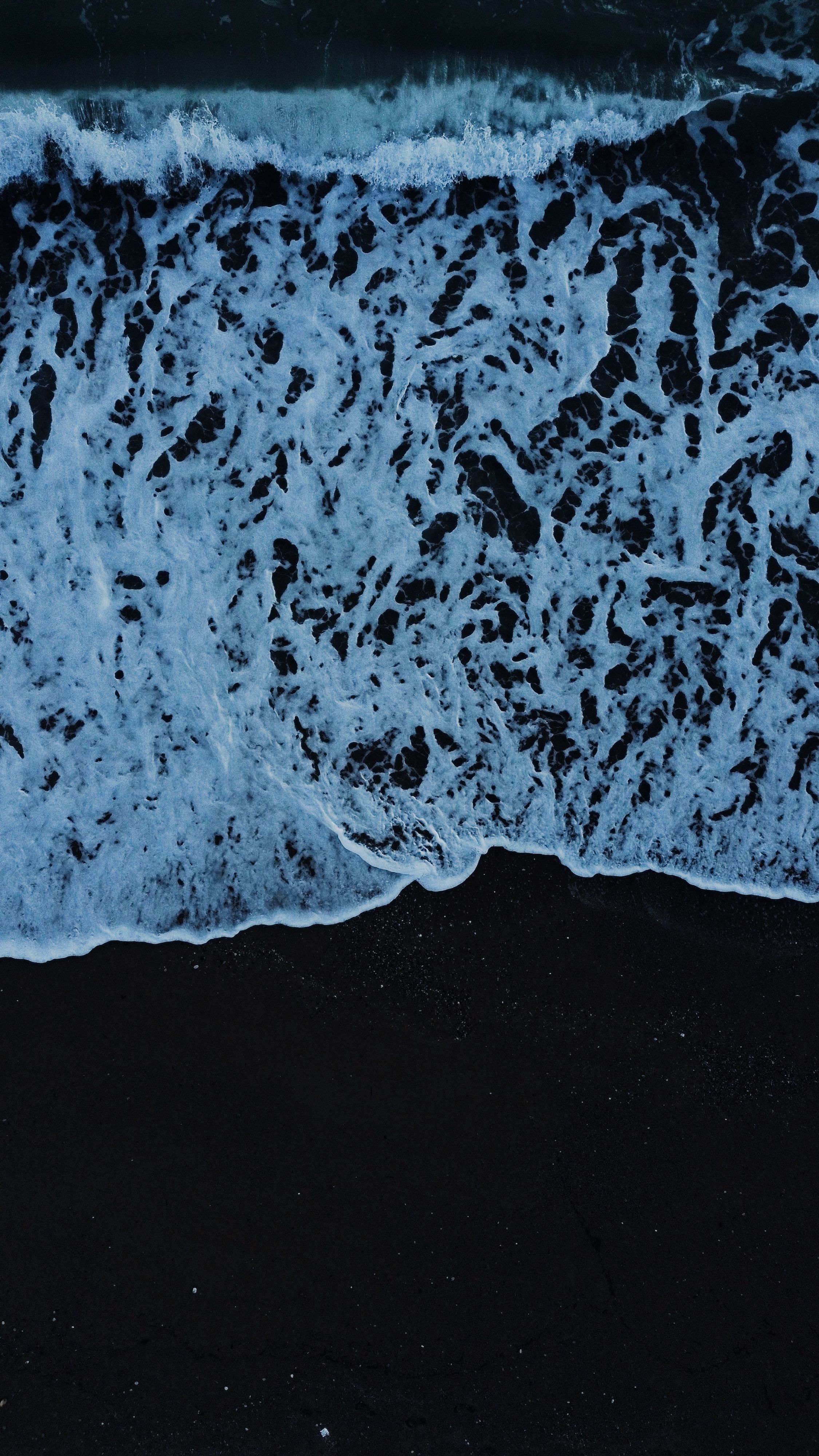 Foamy Sea Wave Spreading on the Beach at Dusk · Free Stock Photo