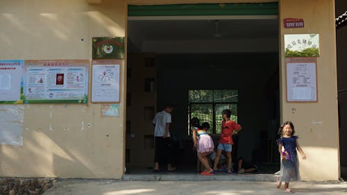 Kids Playing in School Entrance