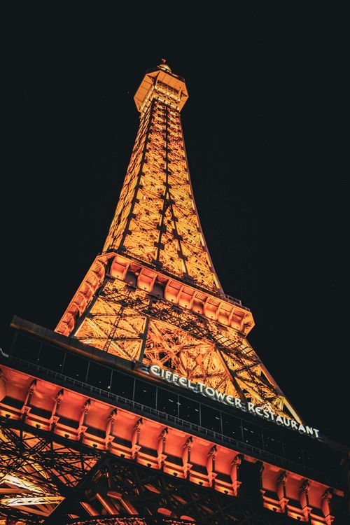 Free Stunning view of illuminated Eiffel Tower replica at Paris Las Vegas resort during nighttime. Stock Photo