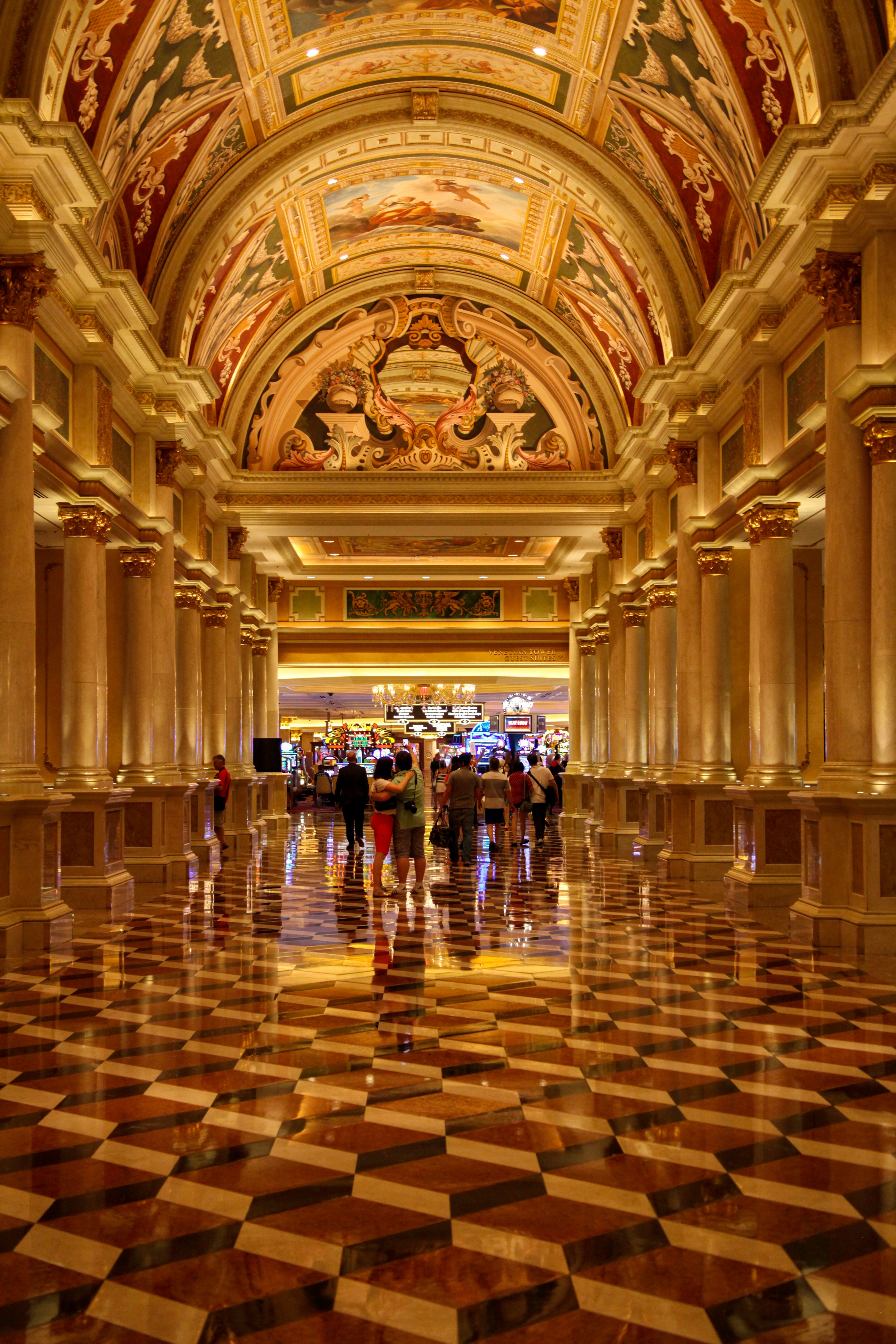 Majestic corridor in Venetian Las Vegas showcasing intricate ceilings and opulent architecture.