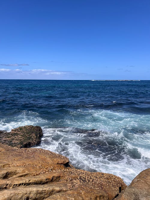 Ocean Foam by Rocky Shore