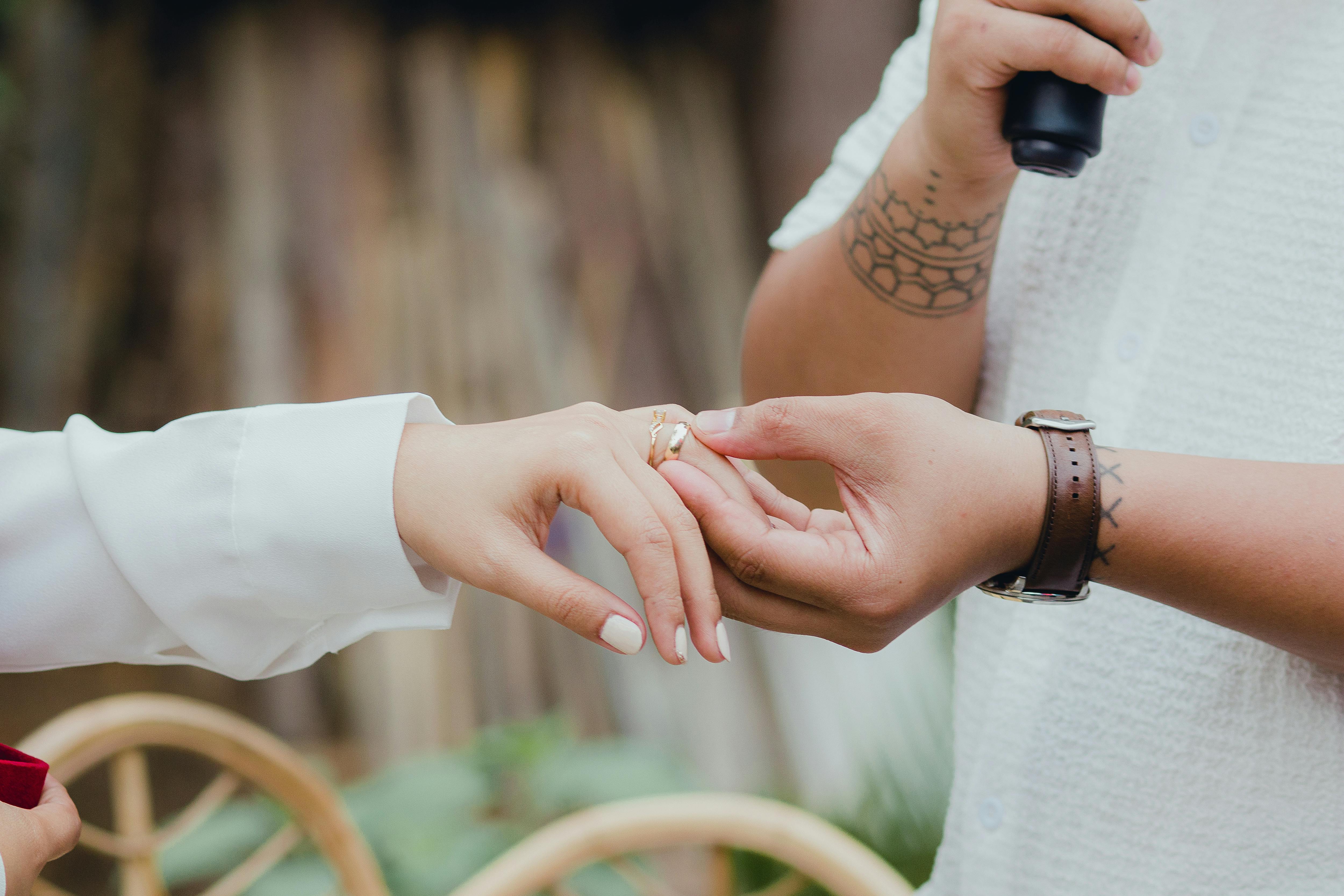 Man Putting Ring on Woman Finger · Free Stock Photo