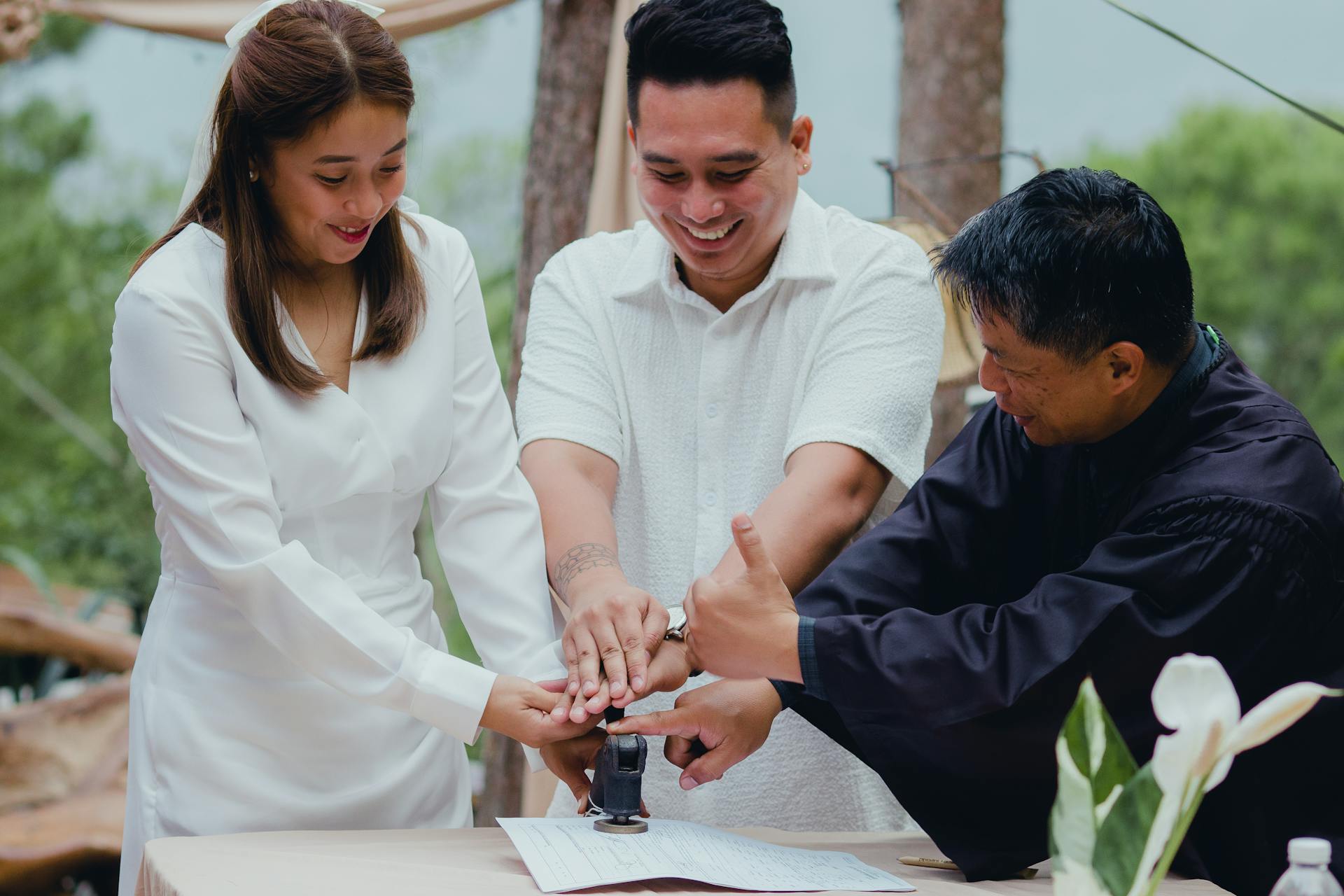 Couple Stamping Wedding Agreement