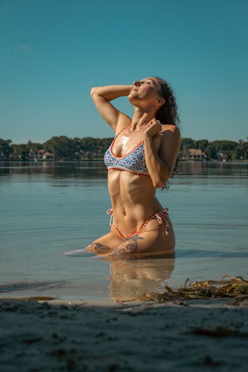 Woman in a Bikini Posing in a Lake 