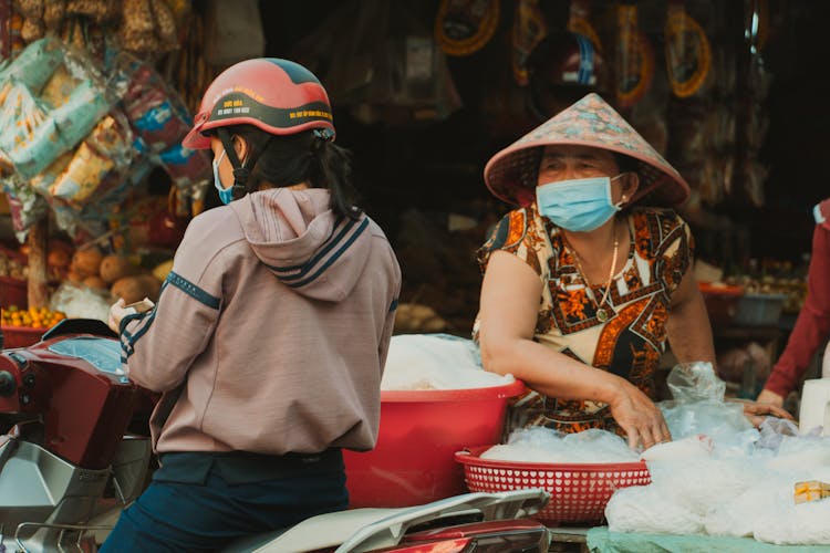 People Selling Products On Traditional Market