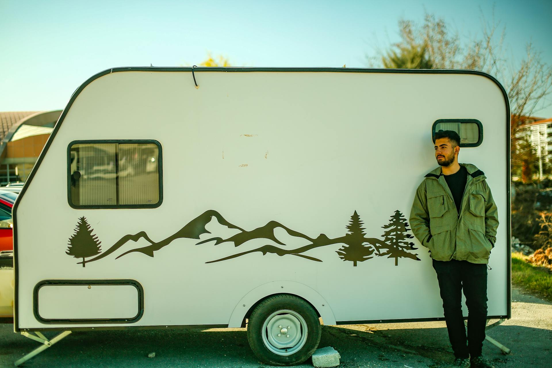 A Man Standing by a Trailer