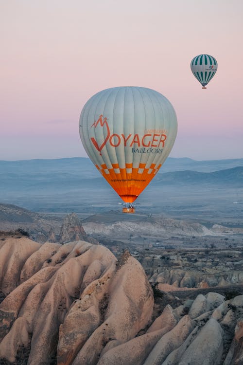 Balloons Flying Above Desert in Cappadocia 