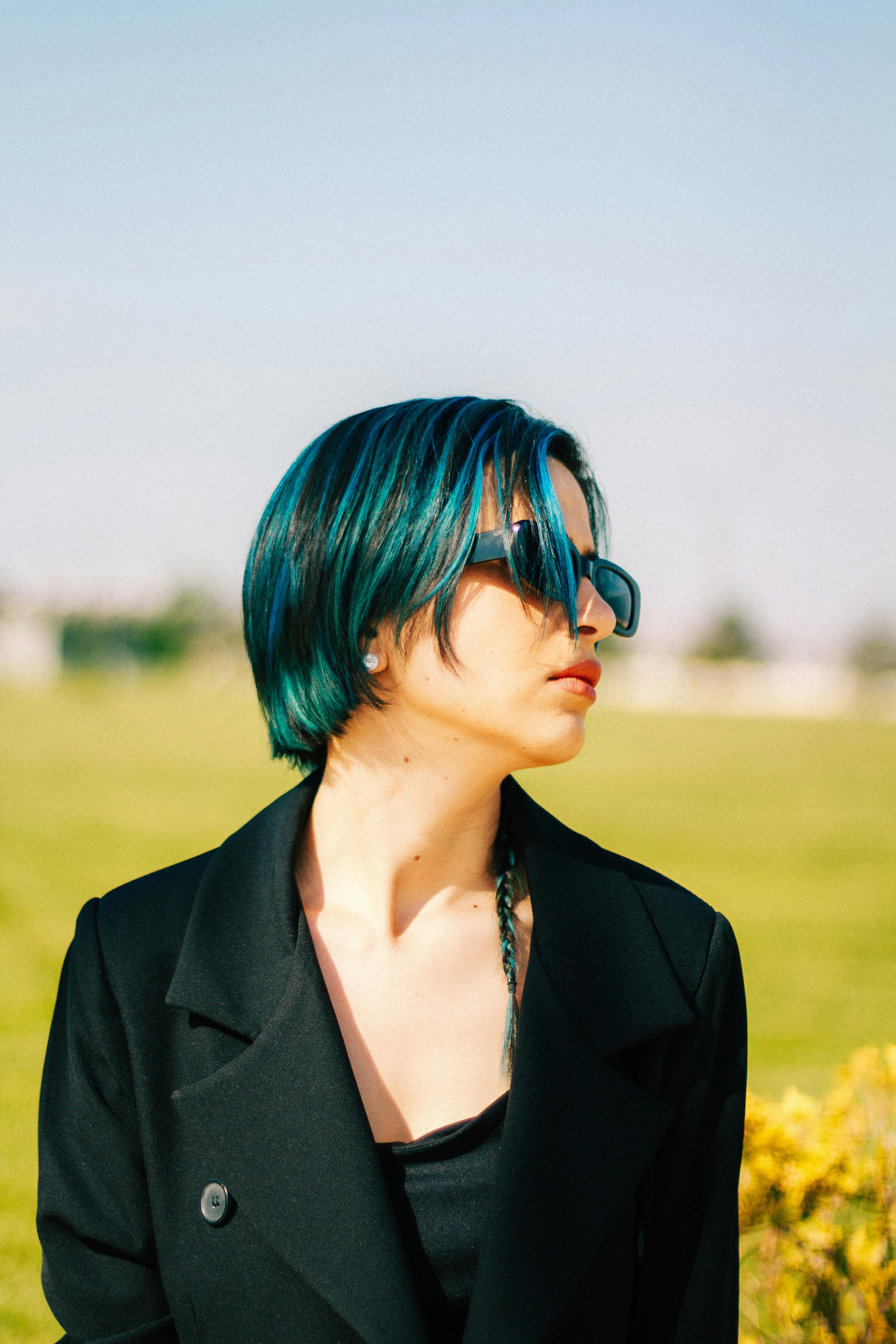 woman with blue hair on the field