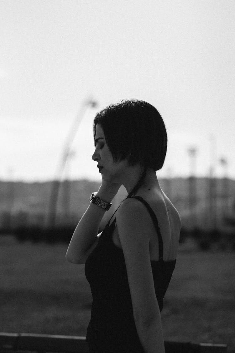 Black And White Photo Of A Woman In Strap Dress