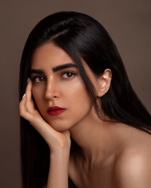 Portrait of a Young Brunette Wearing Red Lipstick 