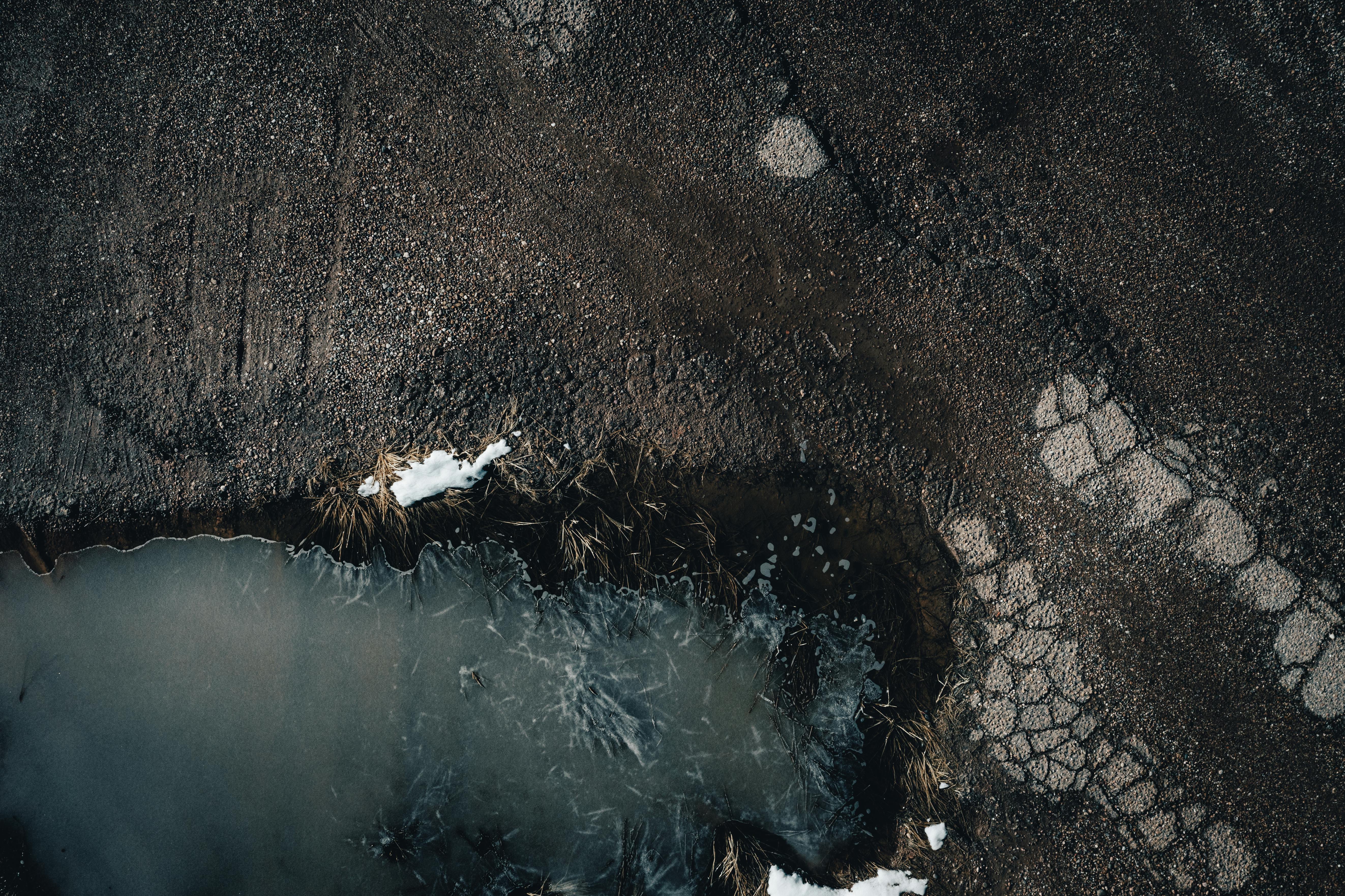 Birds Eye View of Frozen Puddle and Ground · Free Stock Photo