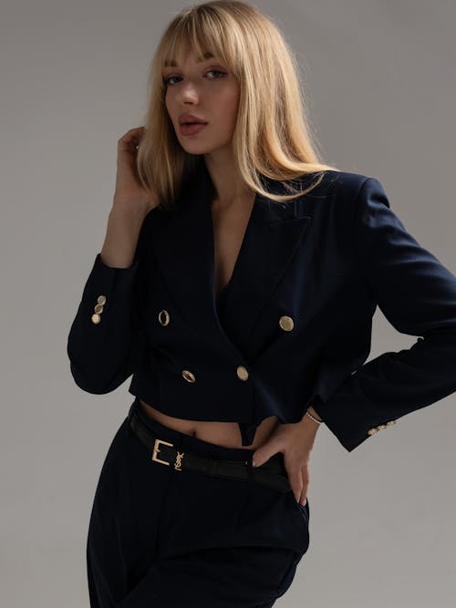 Model in a Navy Blue Bolero with Golden Buttons and Pants