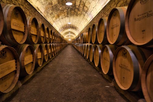 Symmetrical View of Wooden Barrels with Wine 