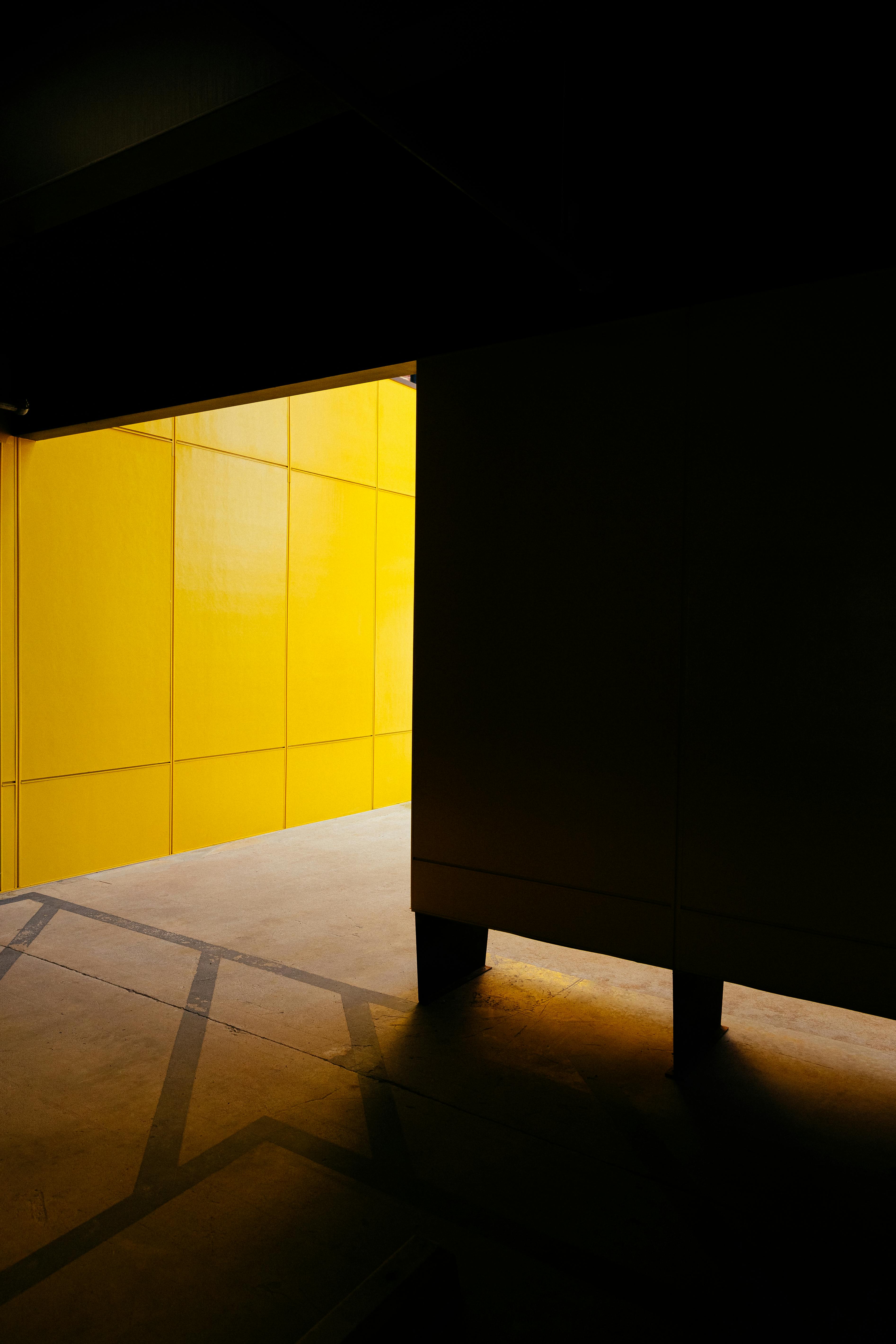 shadow on walls and yellow walls behind