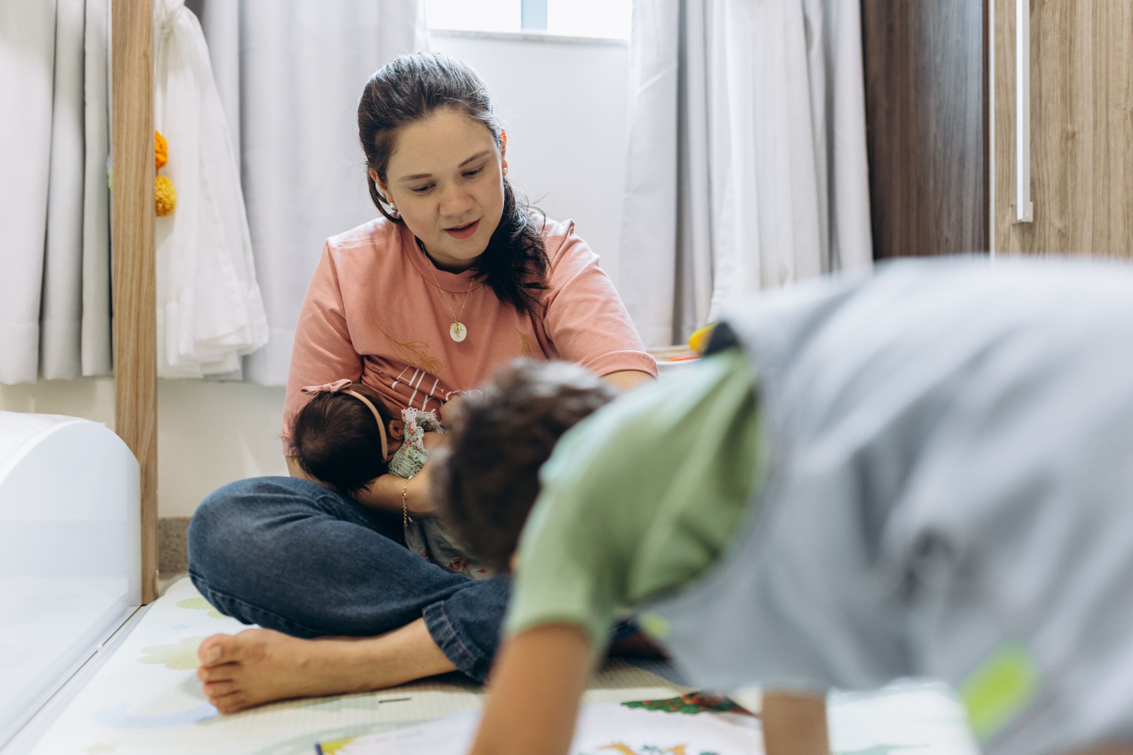 Woman Sitting with Baby and Playing with Son · Free Stock Photo