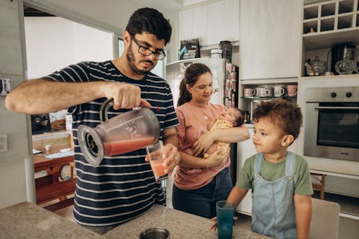 A family enjoys a morning together in their kitchen, making fresh juice.