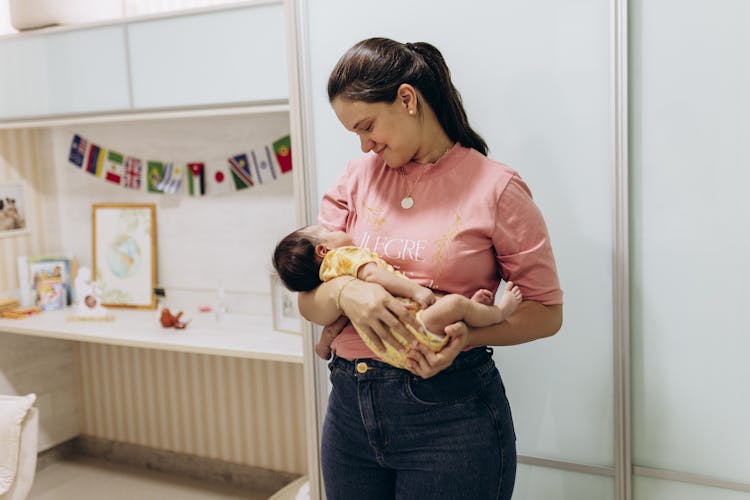 Smiling Mother Holding Baby