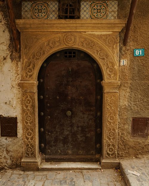 Free Beautiful ornate doorway in the ancient Casbah of Algiers, showcasing intricate craftsmanship. Stock Photo