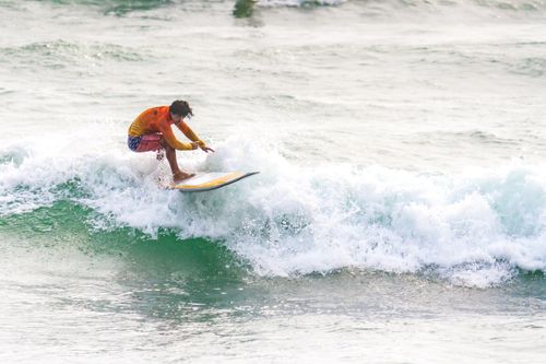 Free Capture of a surfer riding the waves in Lima, showcasing skill and passion. Stock Photo
