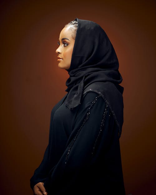Woman Wearing Black Dress and Headscarf