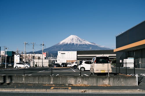 Cars on a Parking Lot with Fuji Mountain in the Distance