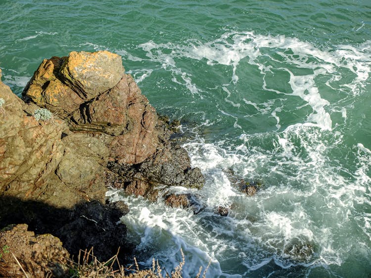 Waves Splashing On Rocky Shore