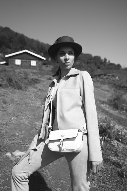 Portrait of Woman in Hat and Jacket and with Bag in Black and White