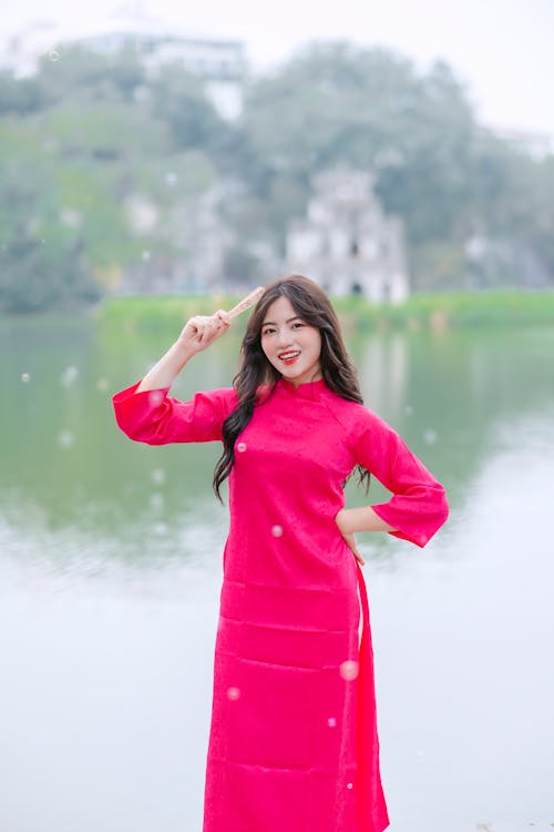 Smiling Woman in Traditional, Red Dress