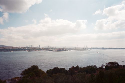Free A serene panoramic view of Istanbul's Bosporus with a hazy skyline and harbor. Stock Photo