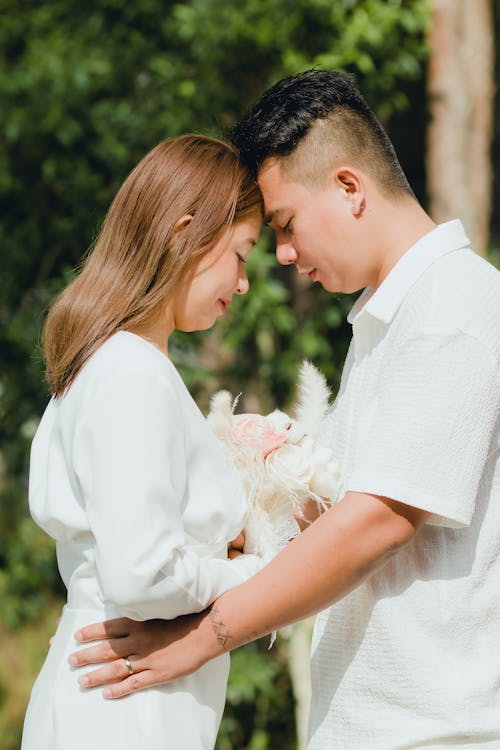 Couple Standing Together with Eyes Closed