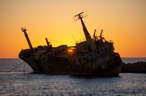 Free A stunning view of the Edro III shipwreck against a vibrant sunset on the Cyprus coast. Stock Photo