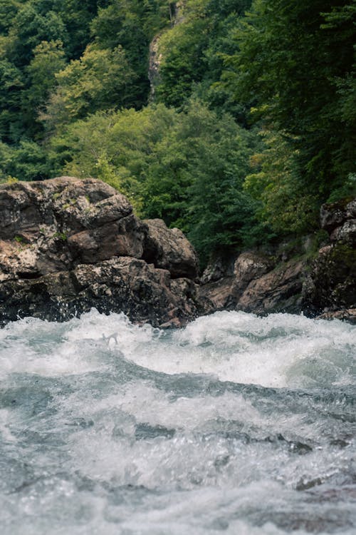 Water Flowing in Cascades in River