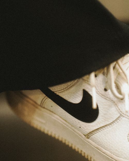 Free Close-up of a modern white sneaker with black details, captured in Berlin. Stock Photo