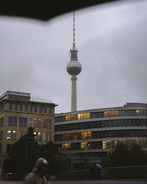 View of the Facade of a Building and the Berliner Fernsehturm in Berlin, Germany 