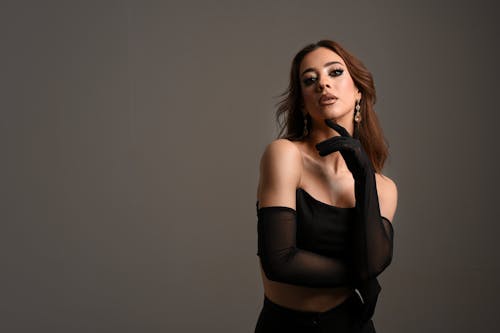 Studio Portrait of a Female Model Wearing Detached Sleeves and a Crop Top