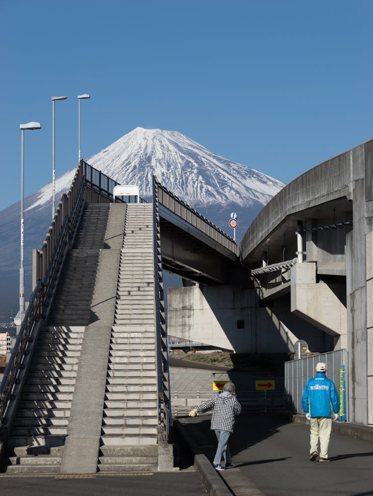 Concrete Bridge In City With Mount Fuji View