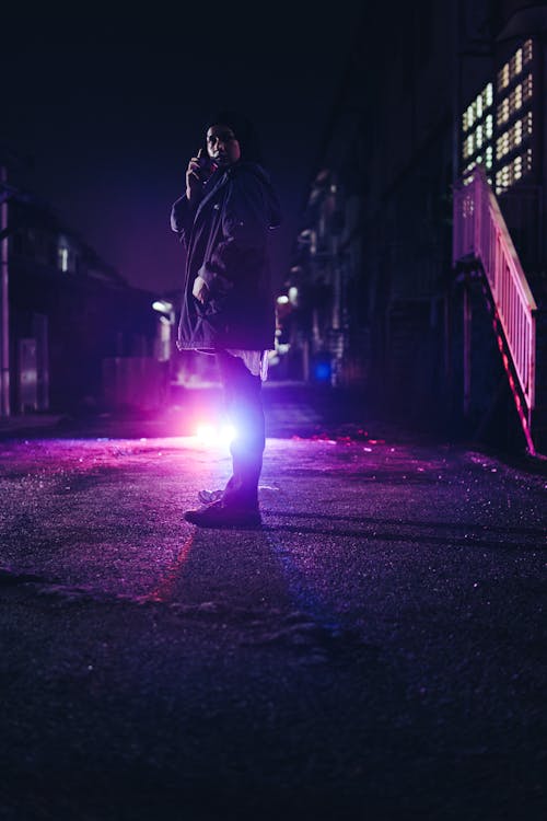 Portrait of a Female Model Wearing a Hijab Standing Outdoors at Night