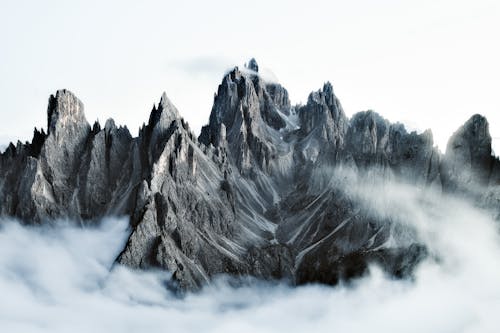 Rocky Steep Dolomite Mountains Above the Clouds
