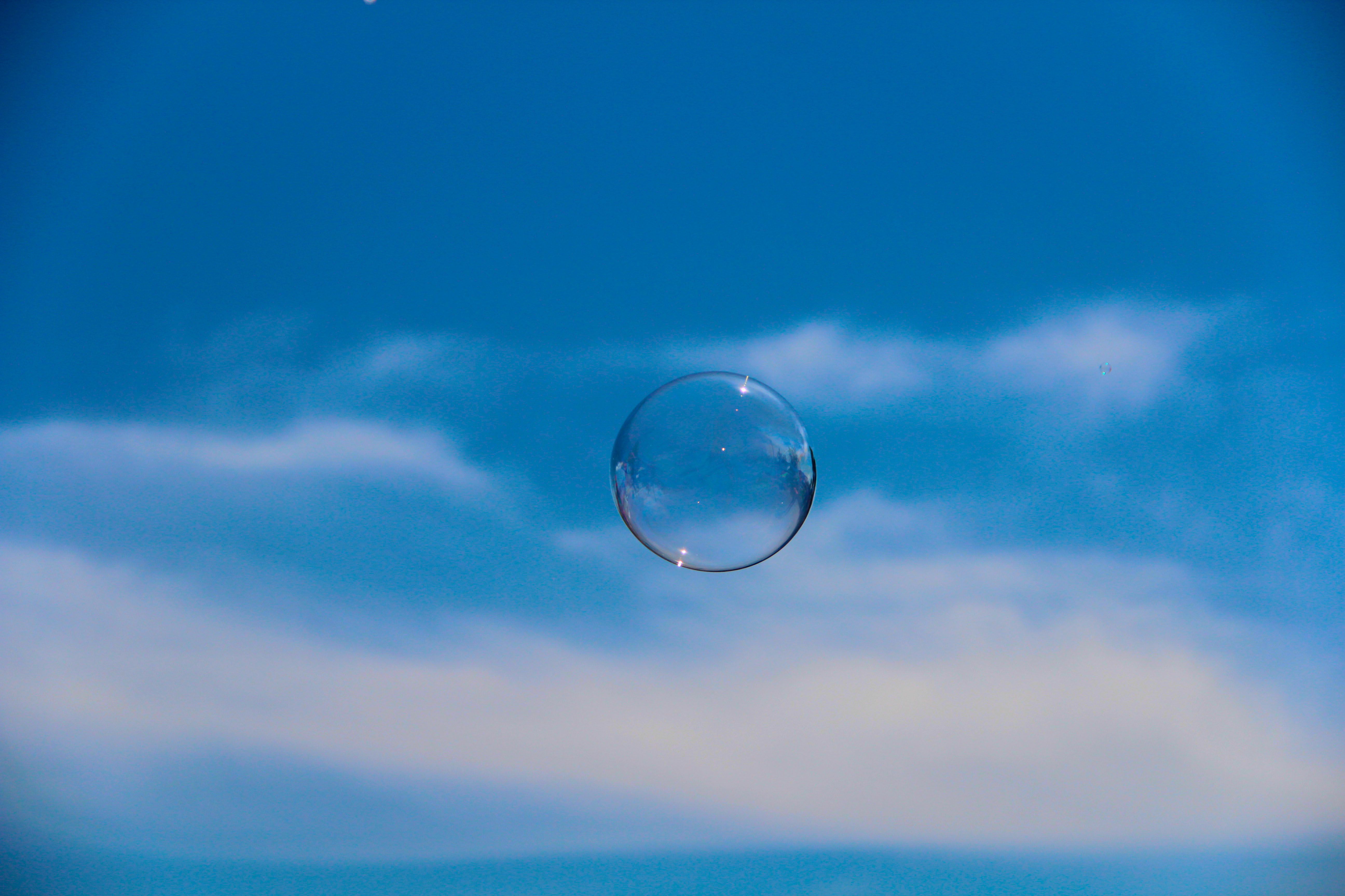 Close-up of a Soap Bubble on the Background of the Sky · Free Stock Photo