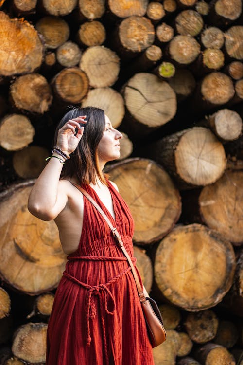 Woman Posing in front of Cut Wood