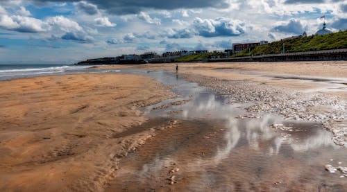 Foto profissional grátis de areia, beira-mar, costa do oceano