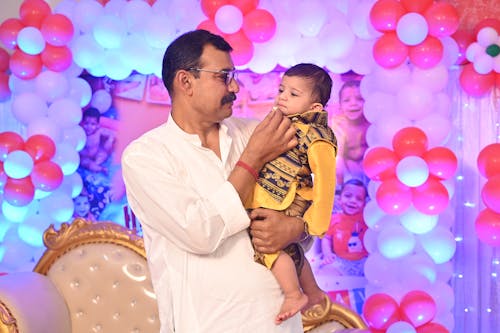 Father Holding Son on Party