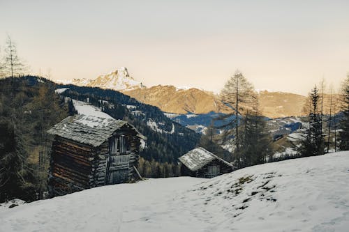 Huts in Mountains on Winter Day