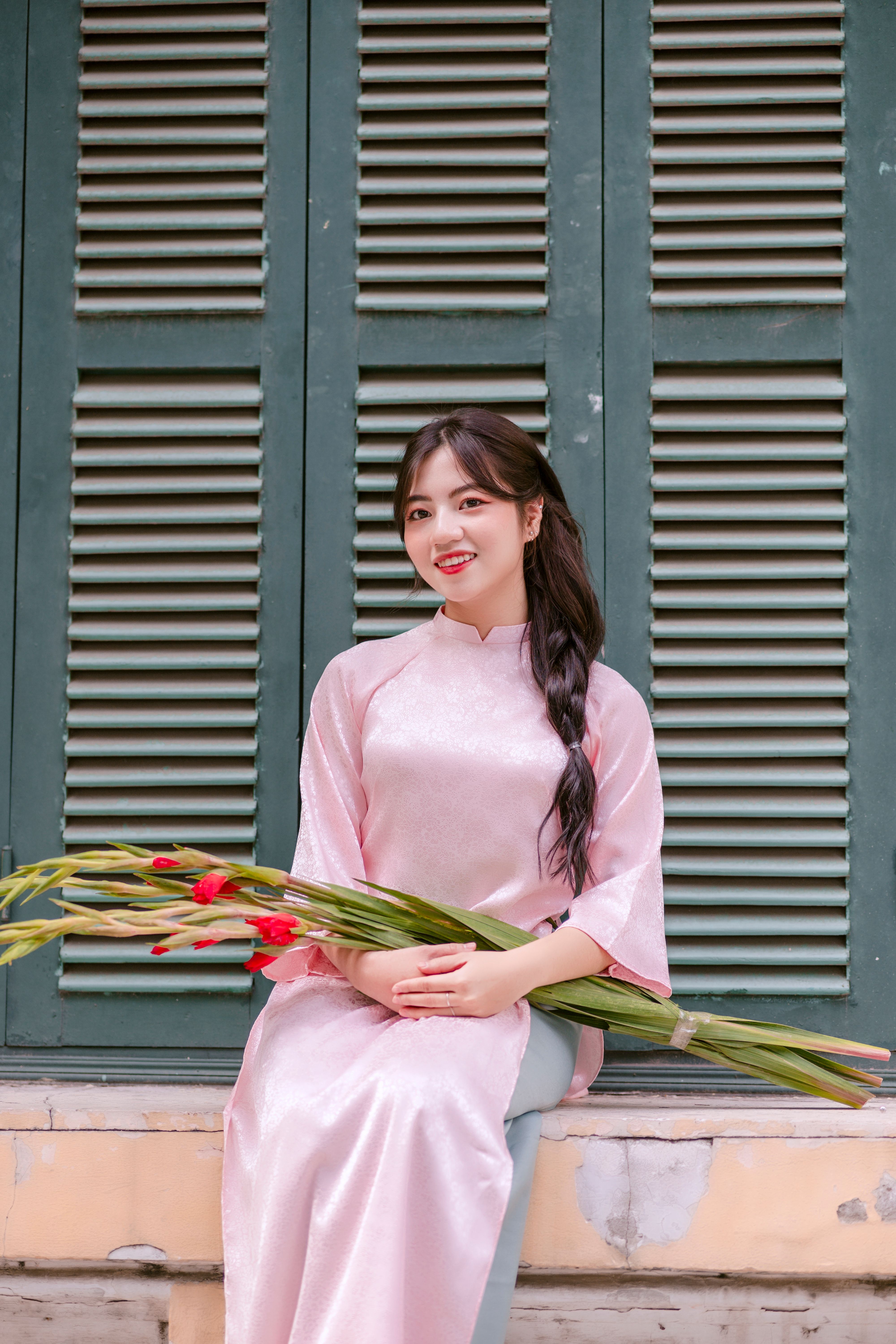 Woman Holding Flowers and Wearing Traditional Dress · Free Stock Photo