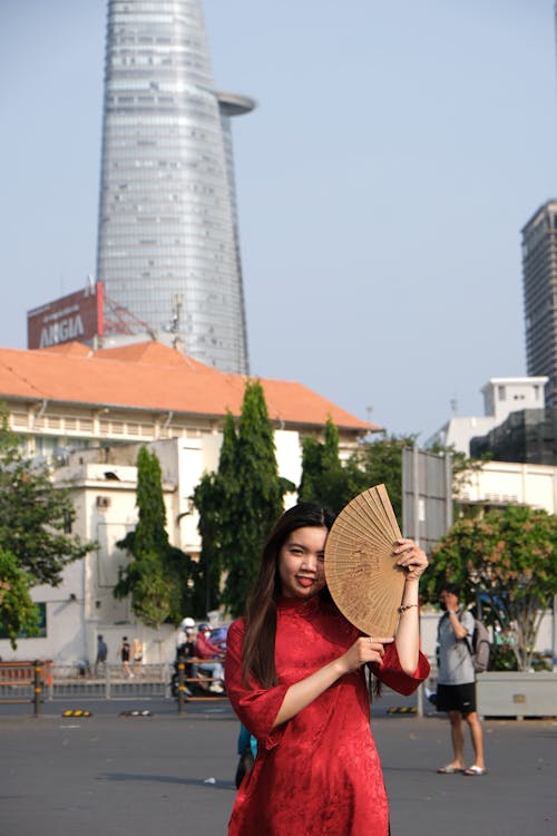 Woman in Red, Traditional Dress and with Fan